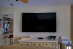 75 inch Smart TV in the primary bedroom 